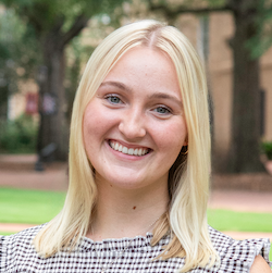 girl with blonde hair smiling