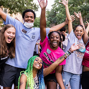 Students cheering at the camera at the first night event.