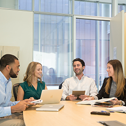 Small group of people having a discussion in a classroom
