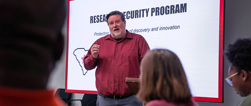 Bob Wertz presents to a room of faculty members