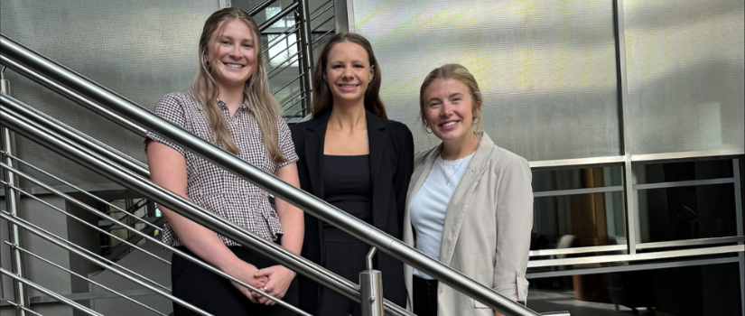 Interns posing on stairs