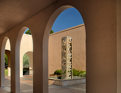 Longstreet Fountain in the center of the outdoor patio surrounded by archways.