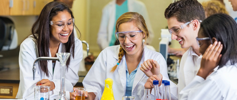 Lab students perform an experiment.