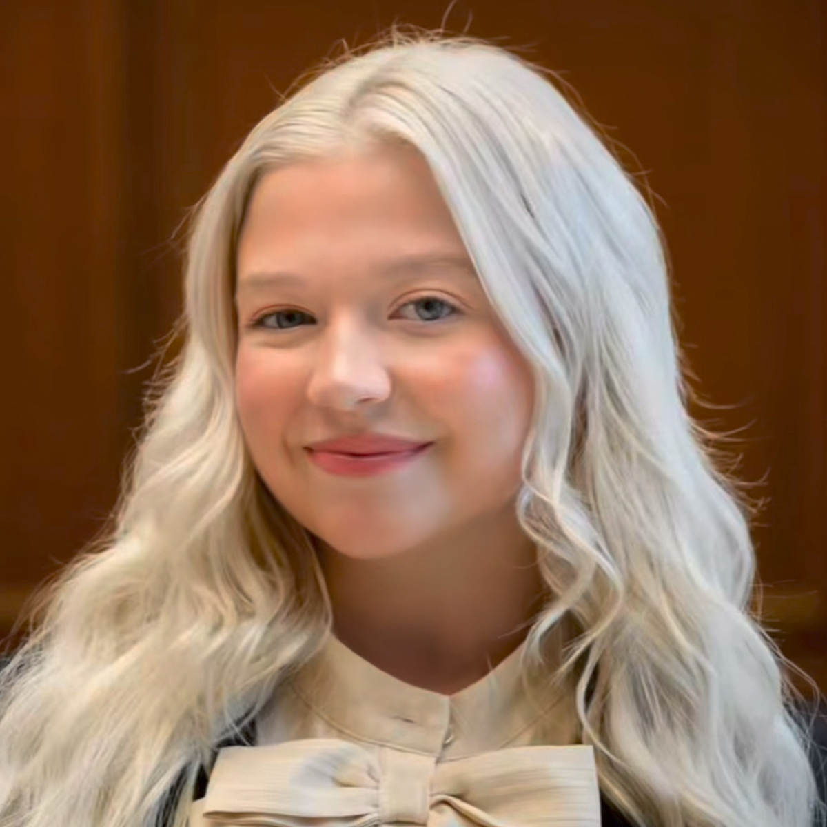 Kaitlyn Byrne, University of South Carolina political science graduate and former dancer, smiles while standing indoors on campus.