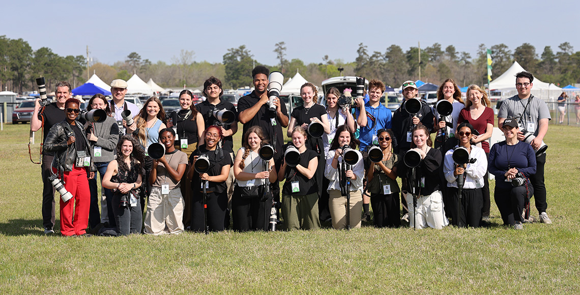 group of students holding cameras