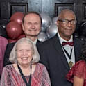 Smiling people and garnet balloons