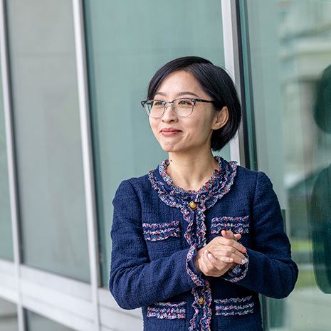 Lucy Yu stands in the Swearingen courtyard