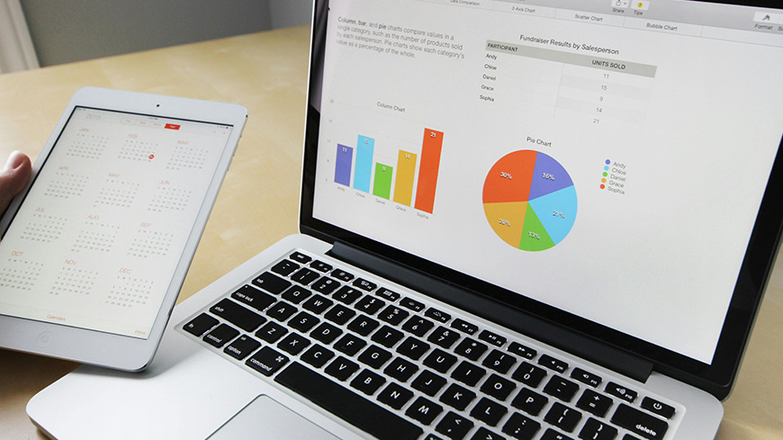 Laptop and tablet with charts