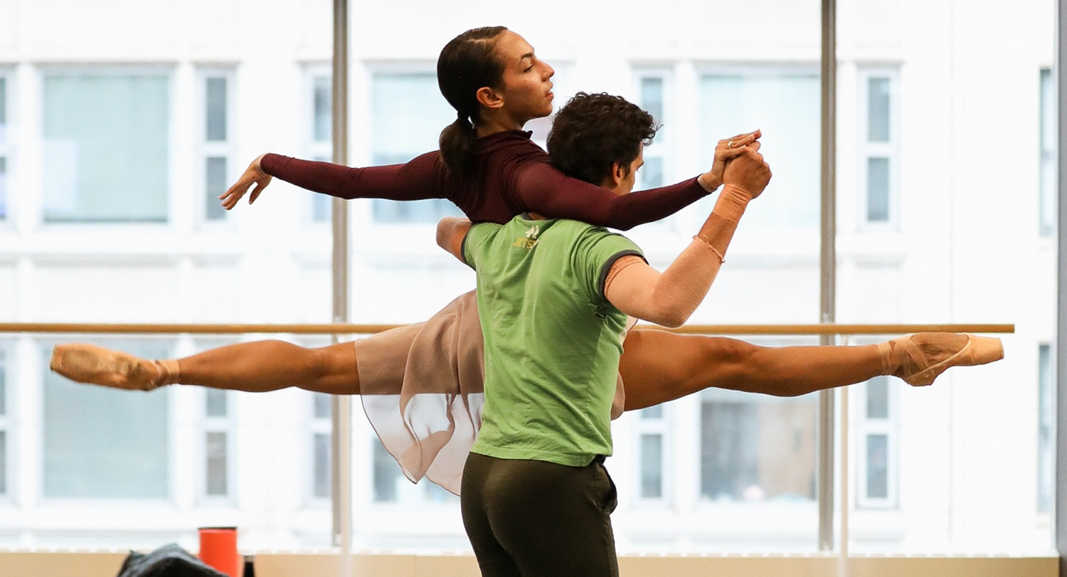 Dancers in studio perform a lift