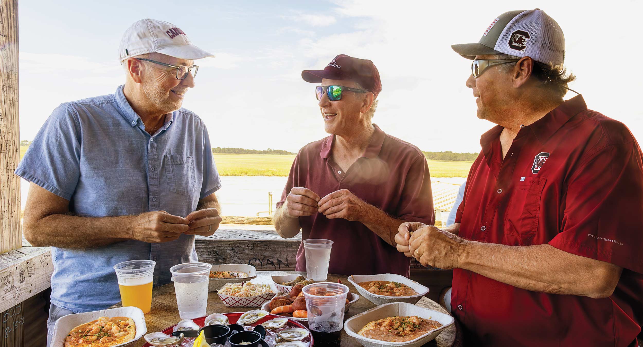 The Molinaroli brothers enjoy oysters at Bowens Island restaurant.