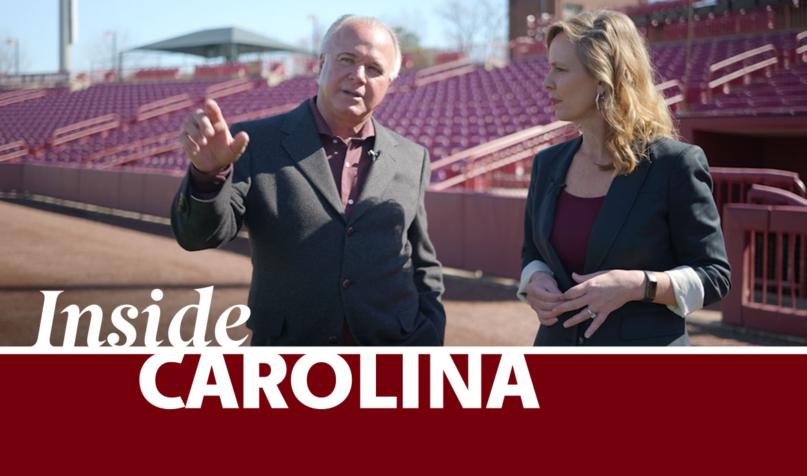 graphic that has a frame with the words Inside Carolina over an image of two people standing in a baseball stadium