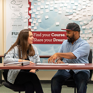 A UAC Advisor works with a student.