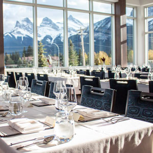 empty dining room with the alps in the background