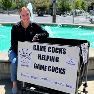 Jenna Wilson poses with Carolina Closets sign.