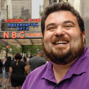 Chris Rosa stands on the sidewalk in front of NBC studios