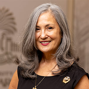 woman standing in front of USC logo