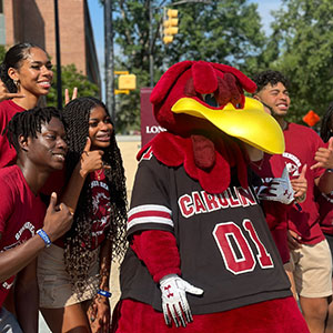 Summer seniors participants pose for a photo with Cocky