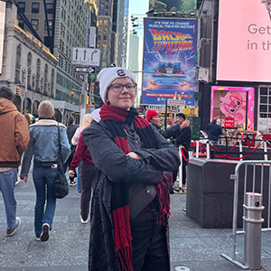 Elise Halbig stands in New York City street. Elise Halbig stands in New York City